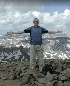 Chris up a mountain